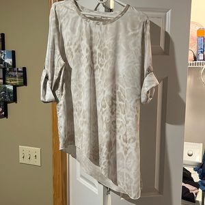 Cute Calvin Klein shirt. Looks great with a black skirt or jeans.